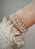 Bracelet on an elastic band with khaki cubic zirconia and natural pearl